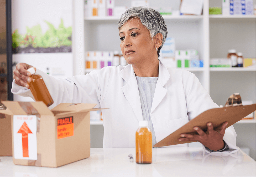 Veterinarian unpacking medication bottles